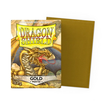 Load image into Gallery viewer, Dragon Shield Standard Size Matte Card Sleeves in Gold are for sale at Gecko Cards! With free UK Postage on all orders over £25 - see the range of Yu-Gi-Oh! Cards, Booster Boxes, Card Sleeves and other trading card game products on our store - all at great prices!
